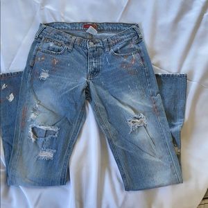 Distressed painted jeans